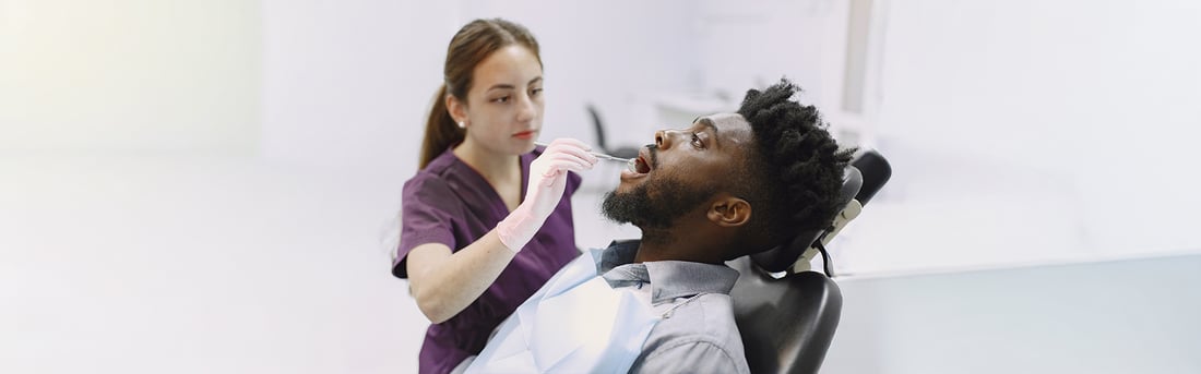 Periodontics in Welland, ON | Gum Health Assessment Dental hygienist in Welland examining a patient's gums during a periodontal check-up