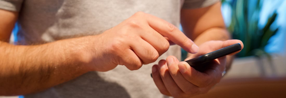 Patient booking a dental appointment on a phone