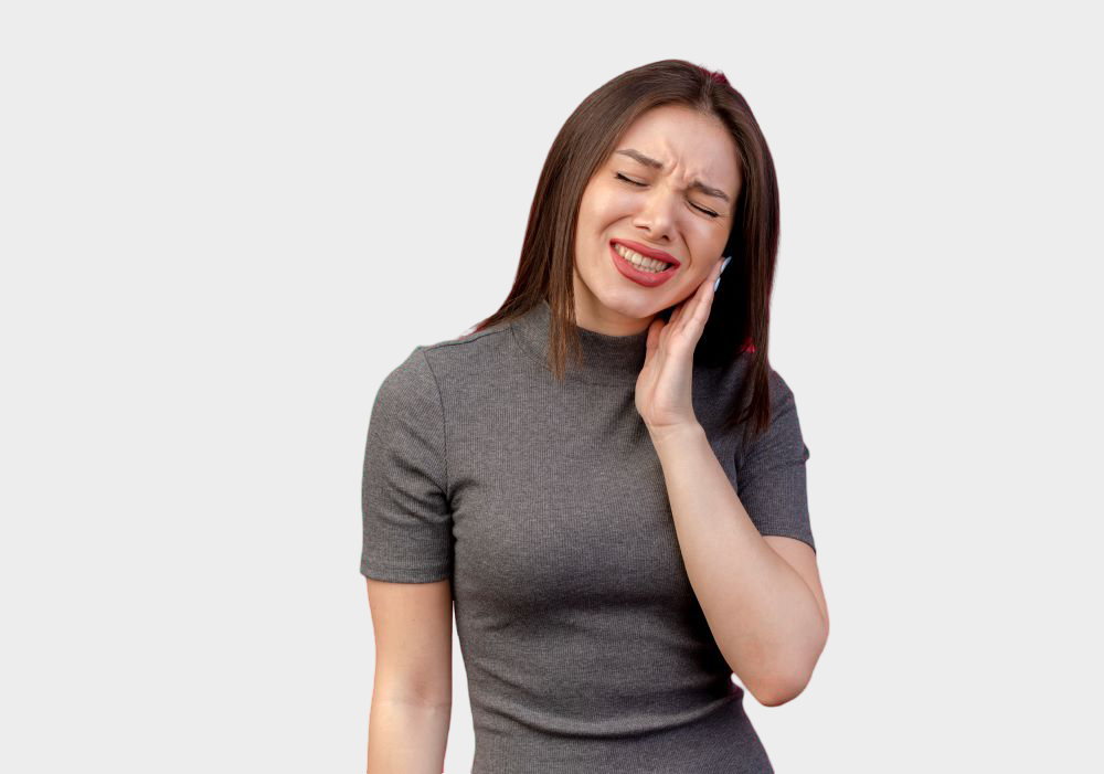 Woman holding her cheek in pain from a severe toothache