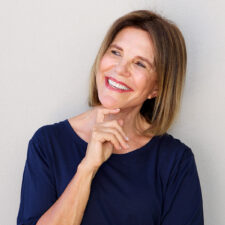 Lady smiling confidently after getting dentures in Welland, ON.