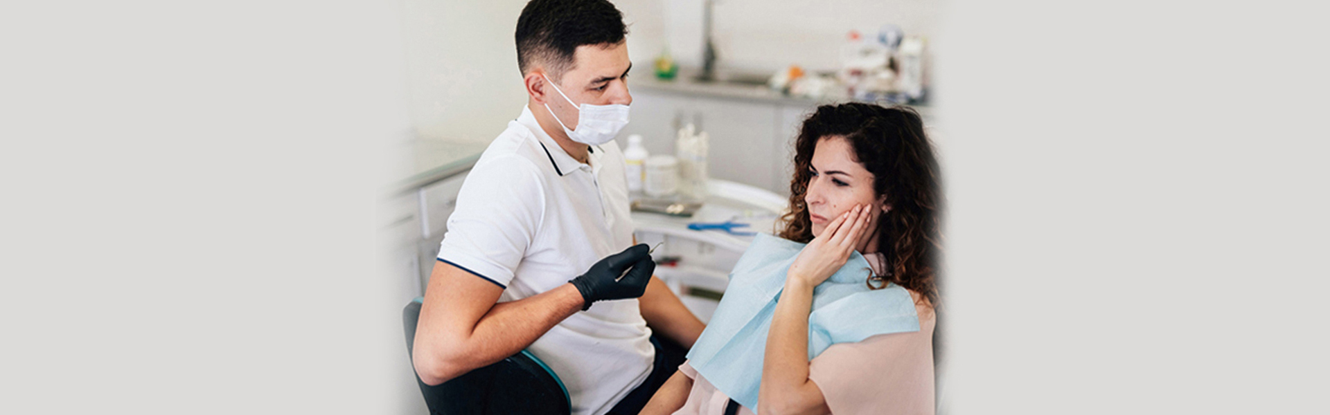 Dentist in Welland treating a patient with severe tooth ache.
