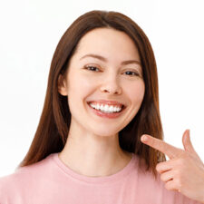 Girl smiling with beautiful white teeth after getting teeth whitening in Welland, ON.